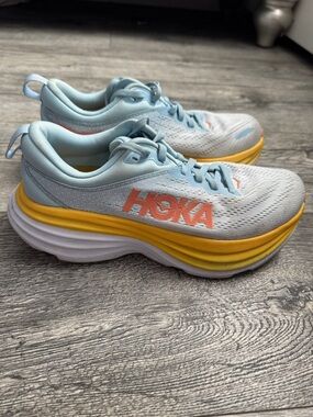 Hoka Light Blue Sneakers with Yellow Midsole and Coral Logo